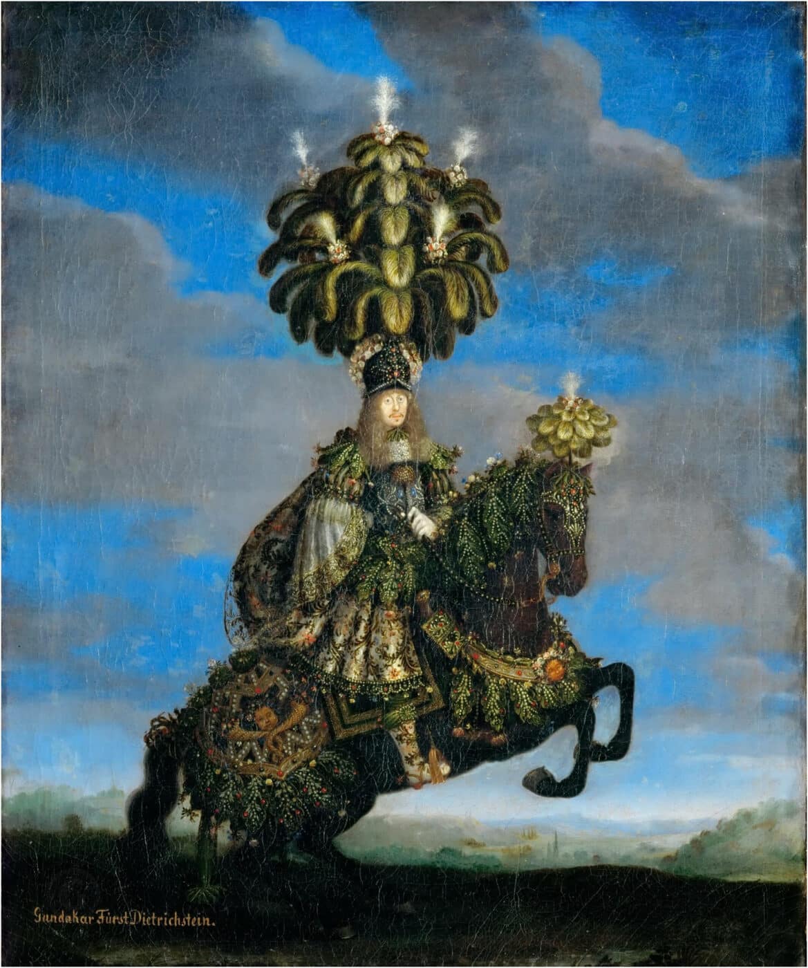 Gundakar, Prince of Dietrichstein, dons an impressive feathered headdress which signifies his power and royal status.